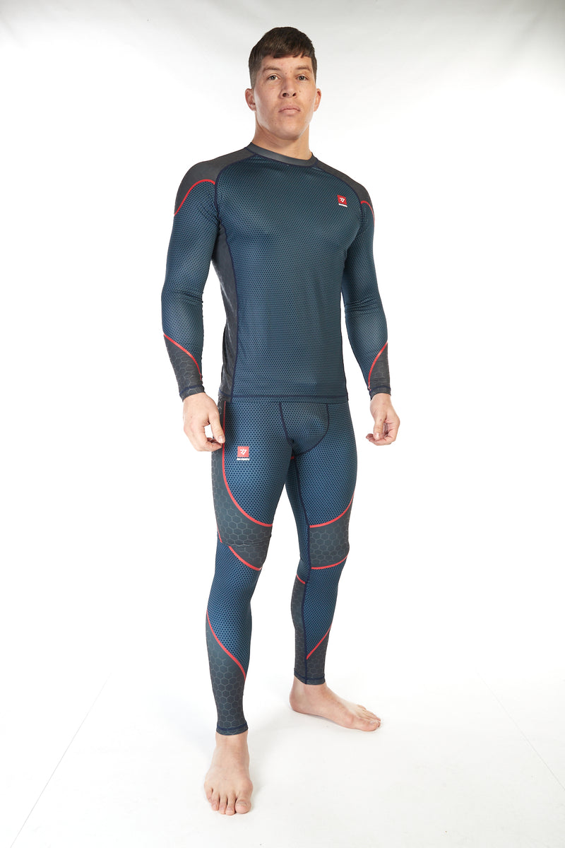 Man wearing blue unisex compression training leggings with red piping across the thighs and shins
