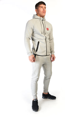 Man wearing unisex grey cotton hoodie (hoody) in a slim fit with full zip and red logo on the chest