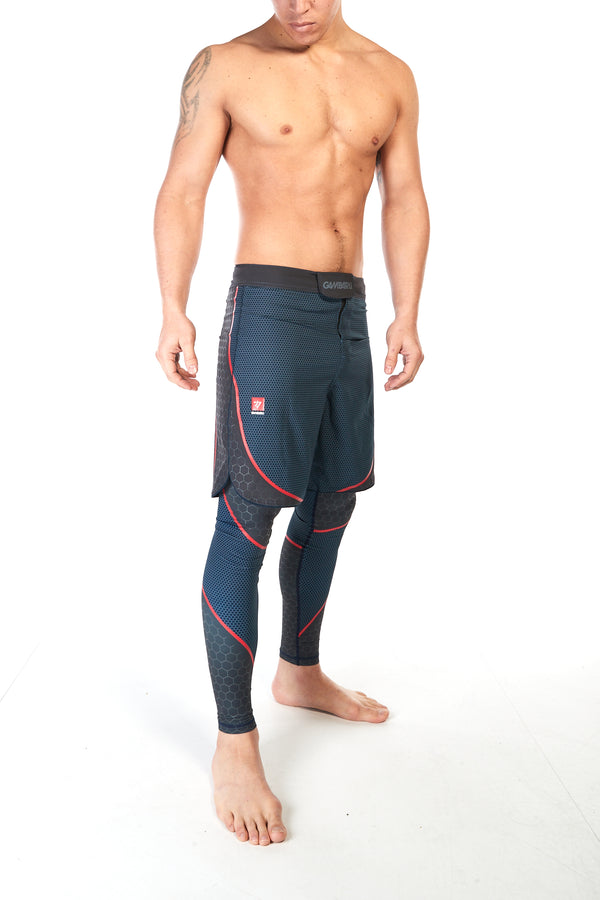 Man wearing training shorts in blue pattern with red piping to shape the thigh