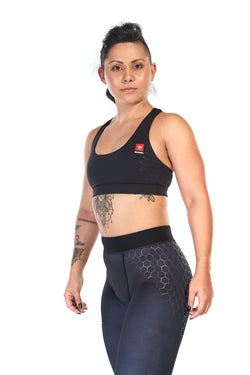 Woman wearing tight fit, racerback sports bra in black