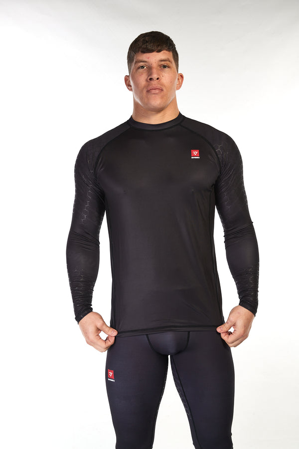 Man wearing unisex long sleeve training top in black with small red Gambaru Fightwear logo on the chest