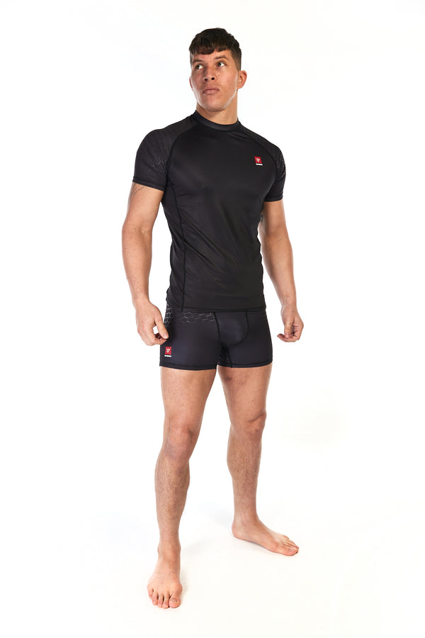 Man wearing compression fit, unisex short training shorts